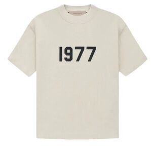 Fear of God Essentials Wheat T-Shirt with Black 1977 Print